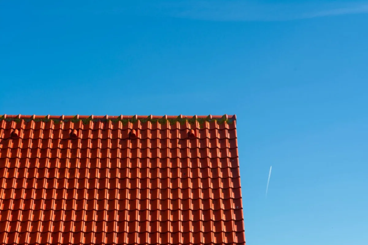 Tile roof gable in full sun, the kind of exposure that sets roof life in Peoria, IL